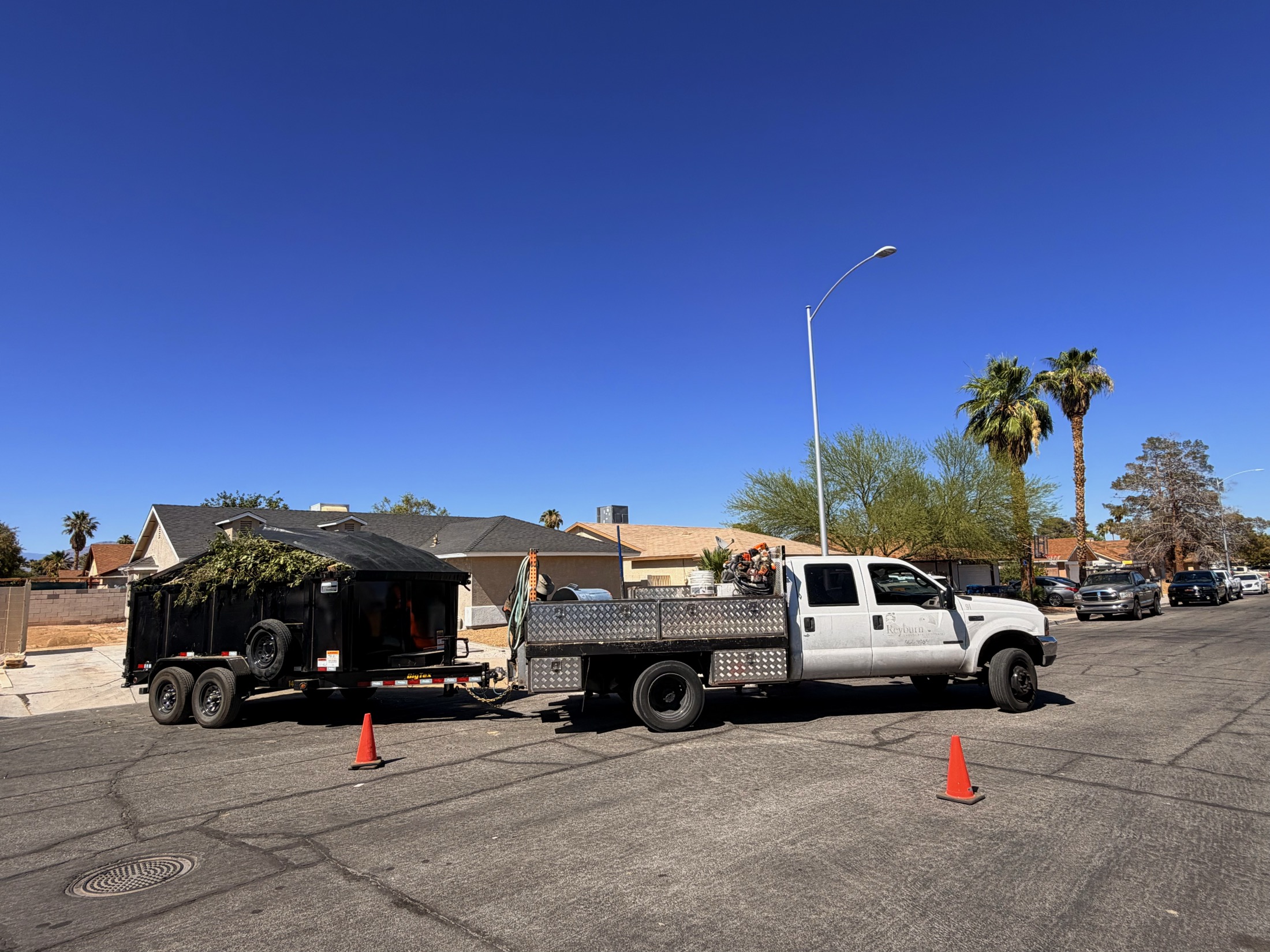 Tree cleanup truck and hauling trailer